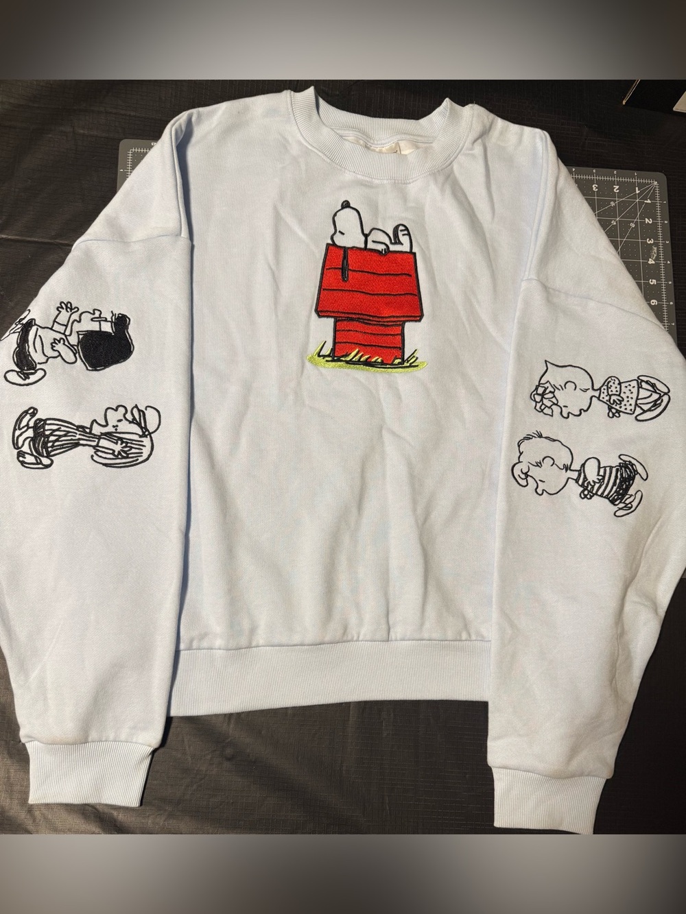 Peanuts Oversized Crew Neck Sweatshirt with Embroidered Red Snoopy Doghouse